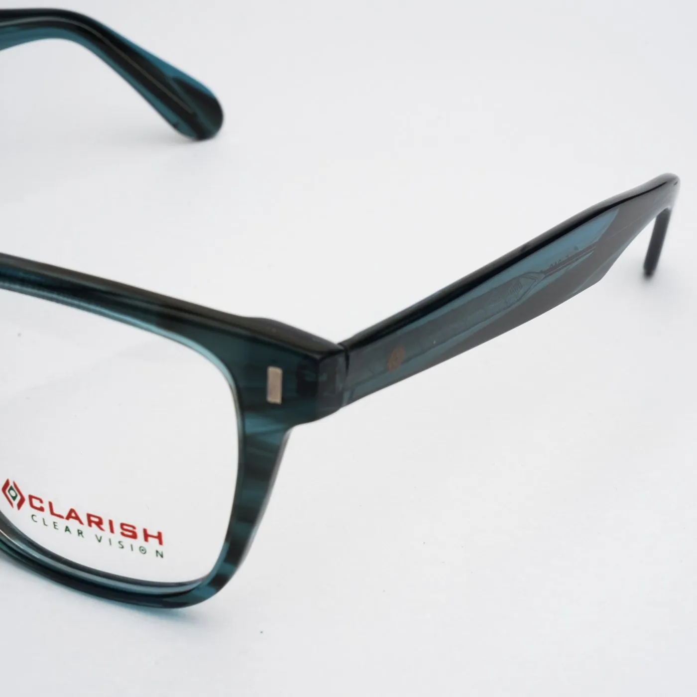 Macro detail of a Clarish™ frame temple showing the printed brand mark and size marking
