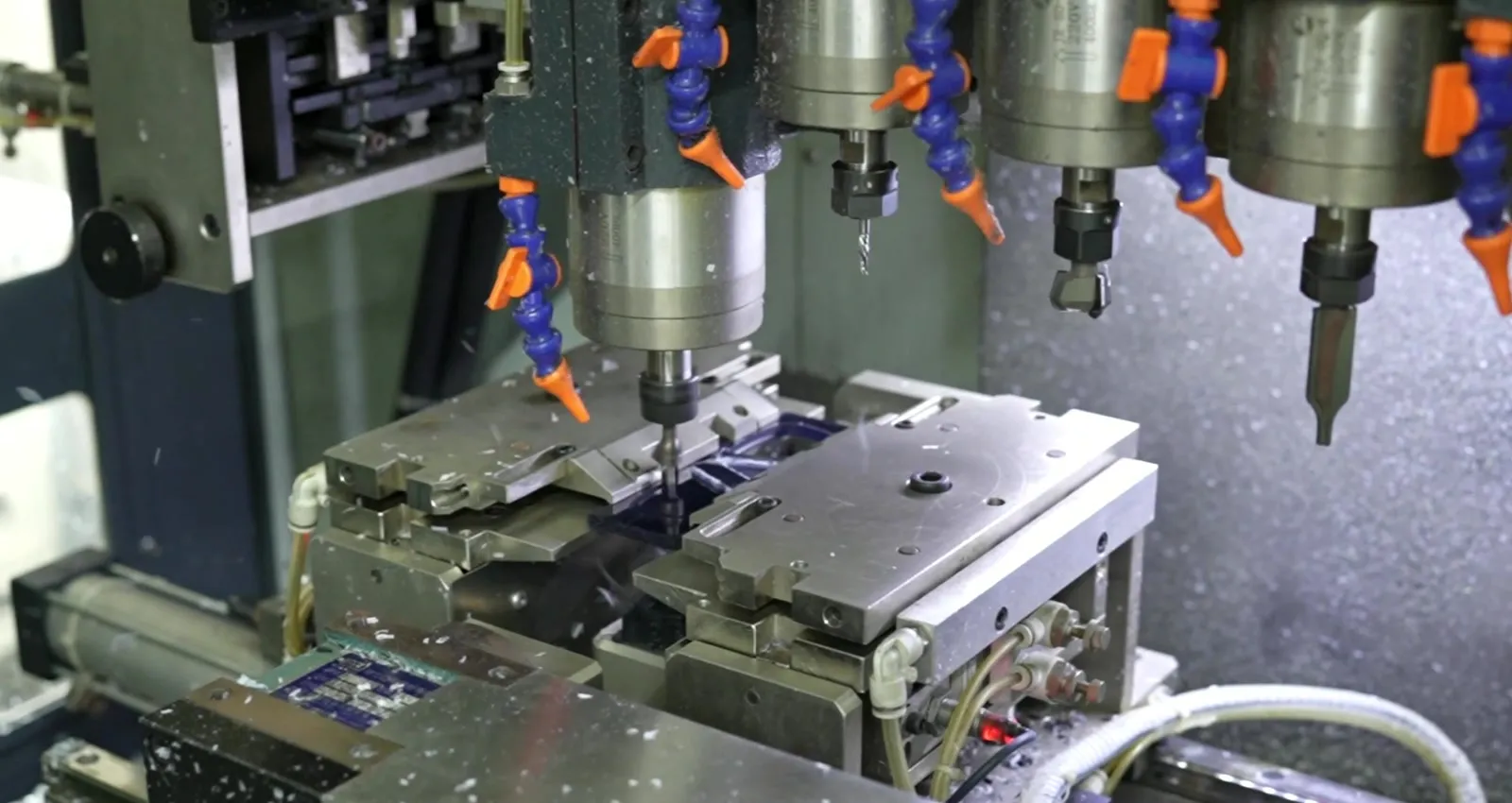 Multi-spindle CNC machining of acetate frame fronts under coolant