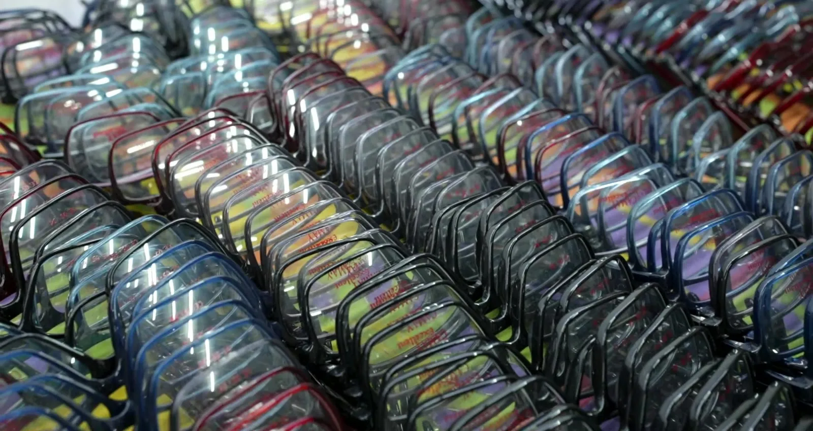 Rows of finished acetate frames on the rack
